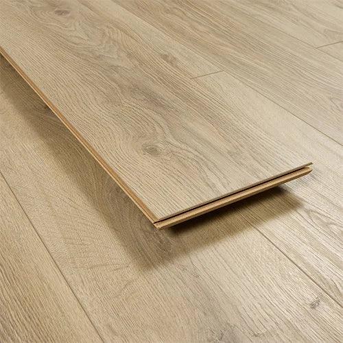 Light oak laminate flooring plank with wood grain texture, close-up on floorboards