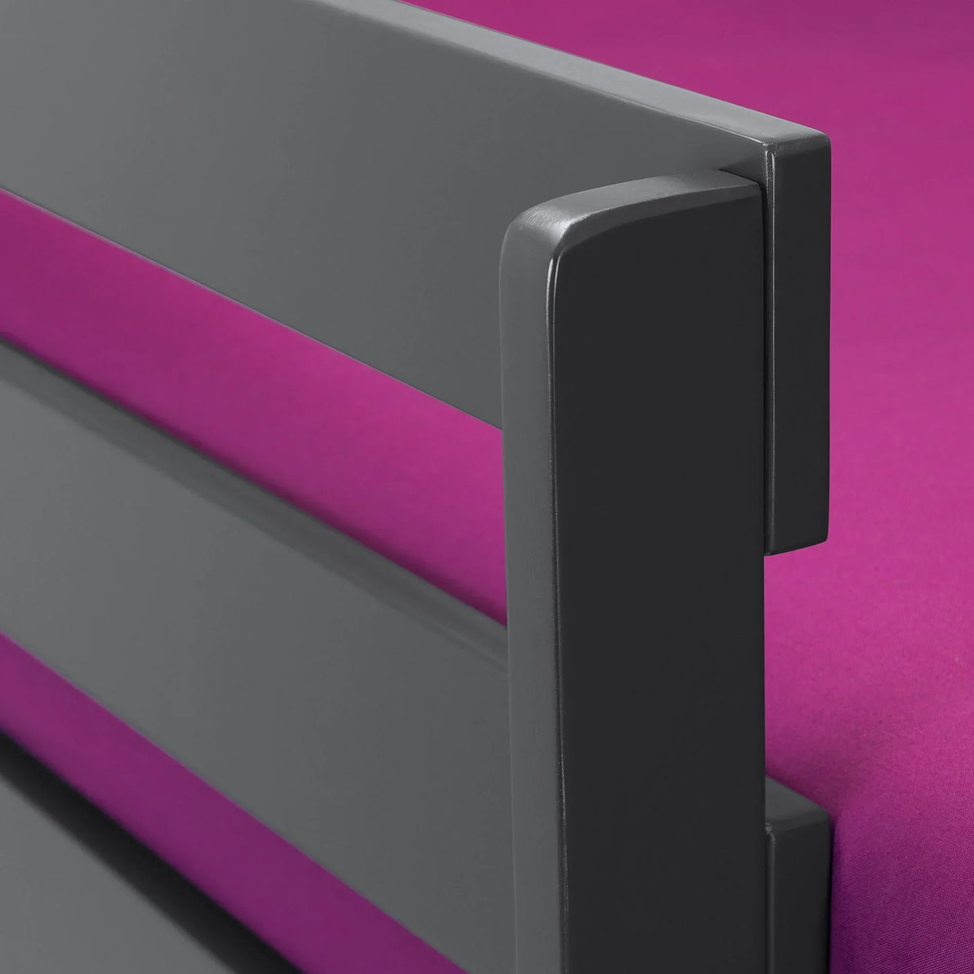 Bella anthracite bunk bed side rail detail with grey finish and pink mattress visible