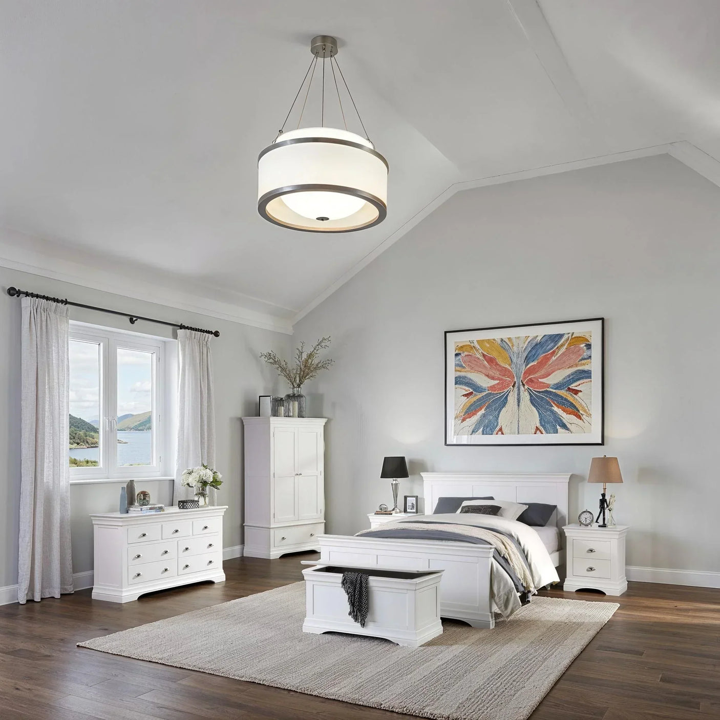 White bedroom furniture set with double bed, bedside tables, wardrobe, and chest of drawers