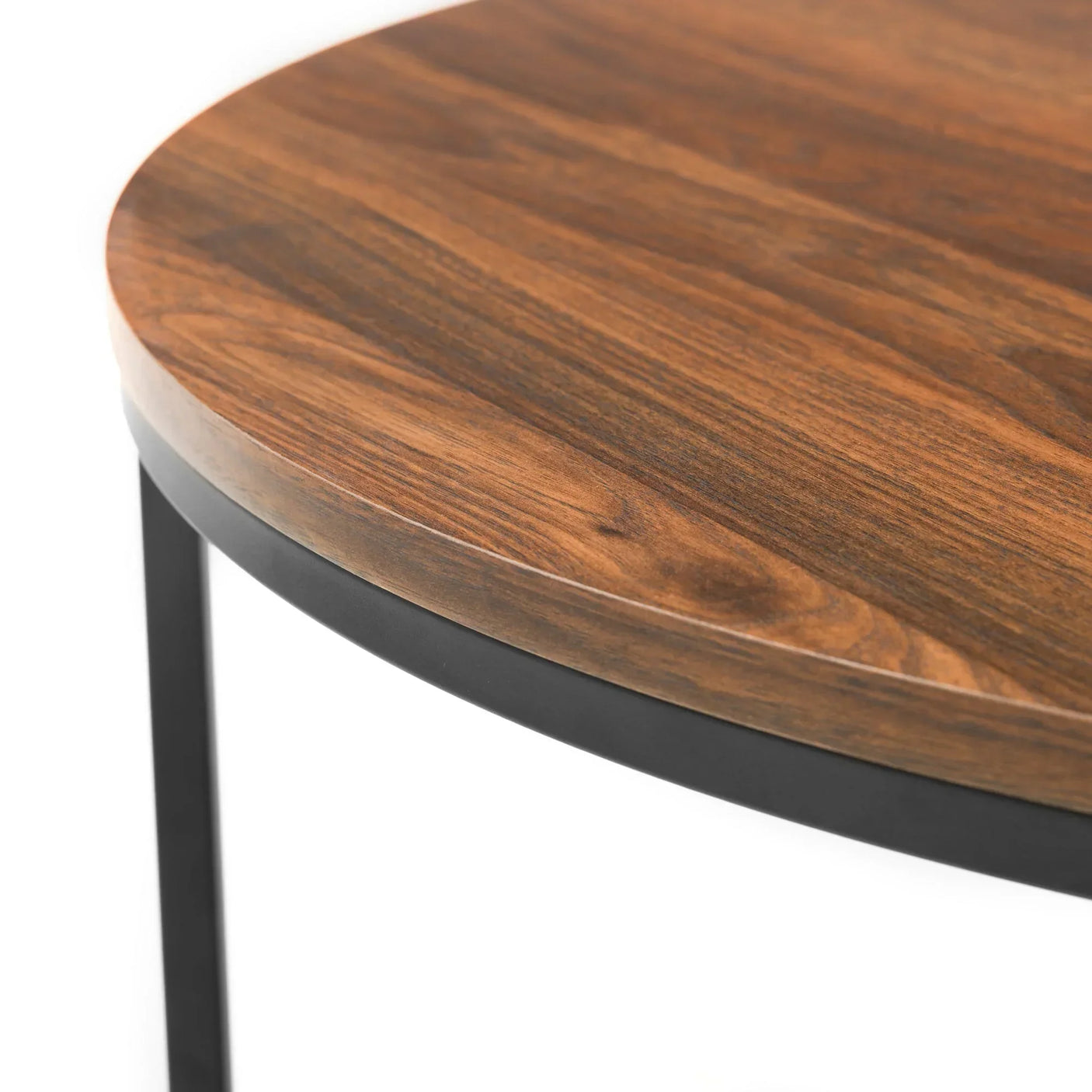 Round nesting coffee table close up showing wood top and black metal frame
