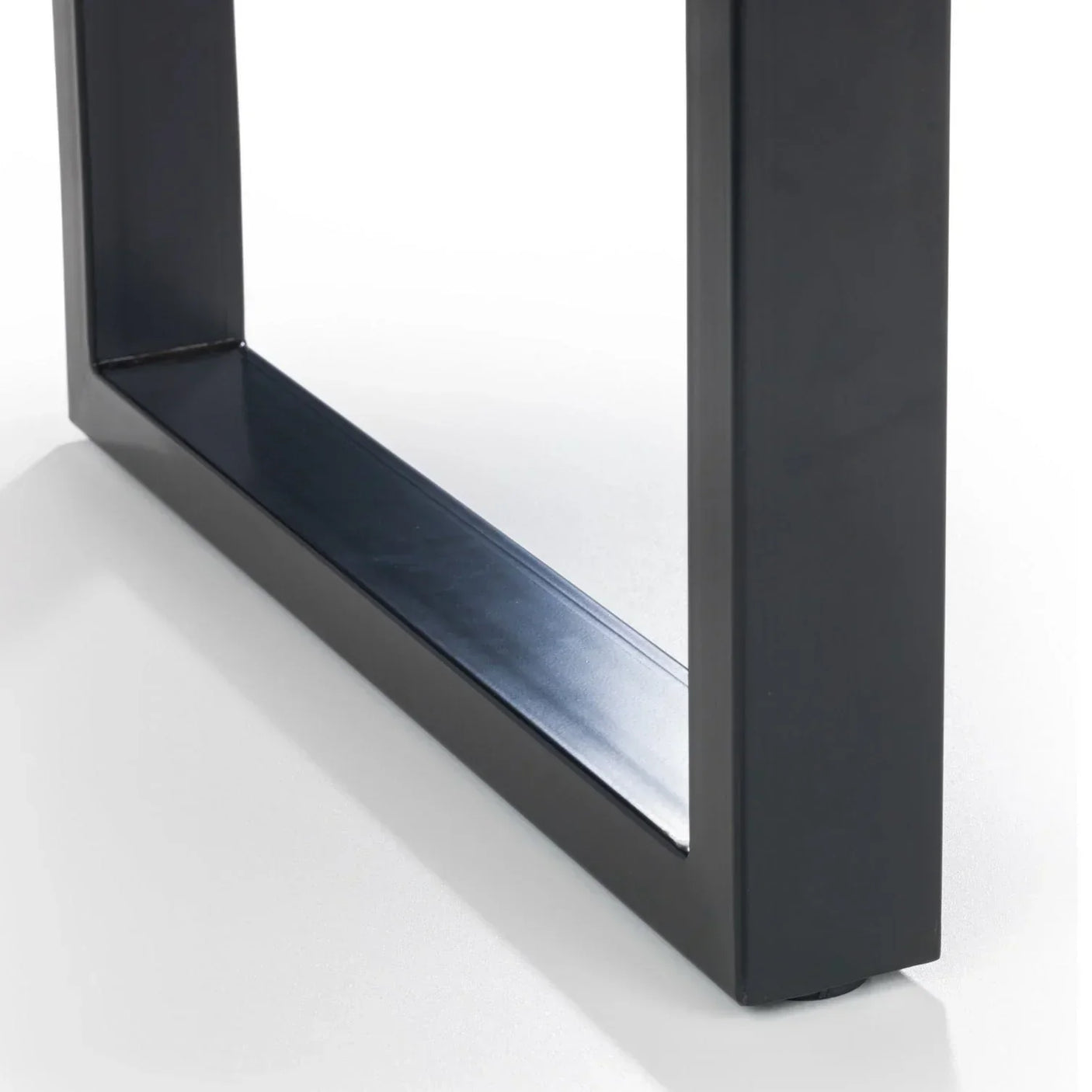 Black metal dining table leg with rectangular frame design on white surface