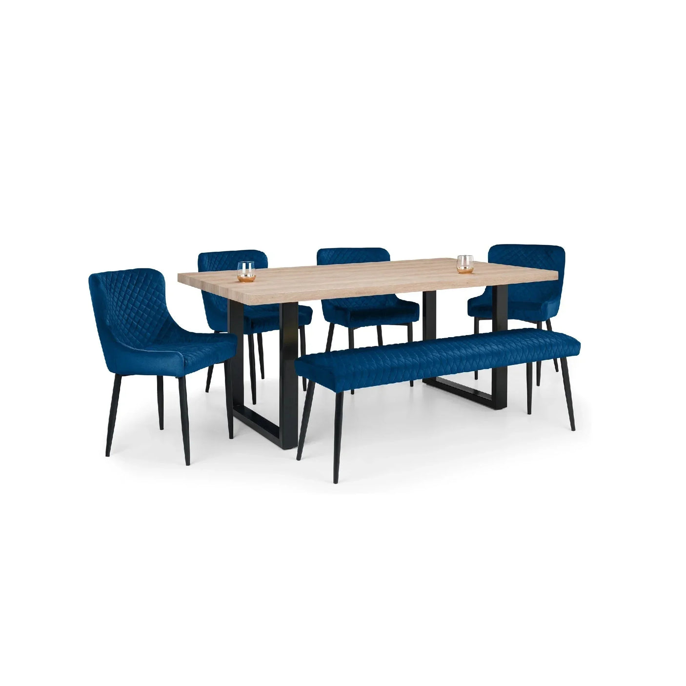 Rectangular wood dining table with four blue velvet chairs and matching blue bench