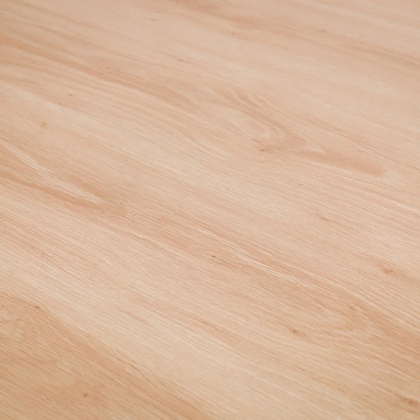 Close detail of oak wood grain on round dining table surface