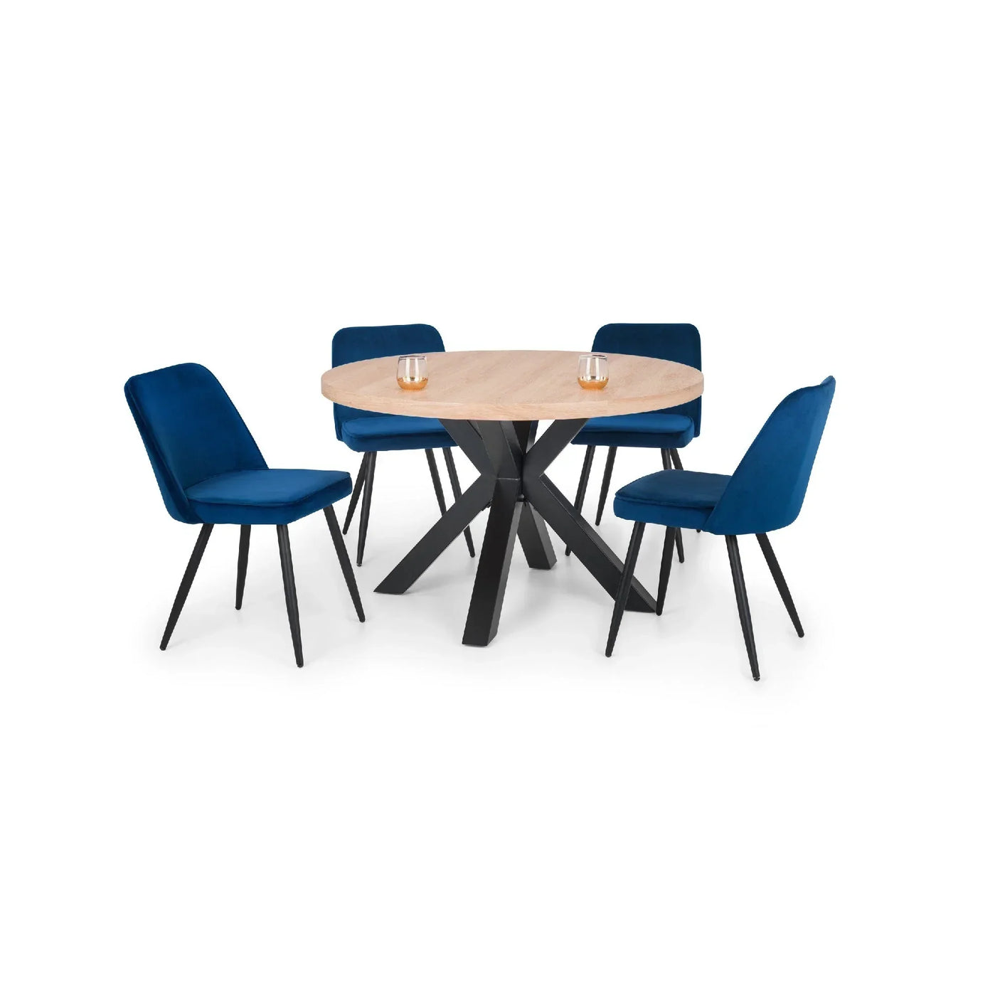 Round wood dining table with black legs and four blue velvet dining chairs