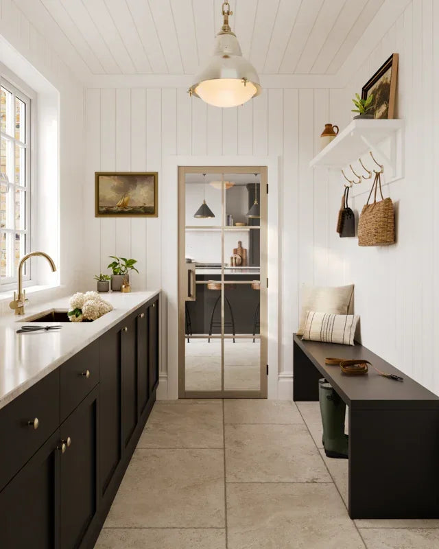 Blonde Oak flooring in a bright entryway with black cabinets and bench seating