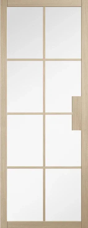 Blonde oak interior door with nine clear glass panels and unique cut out detail