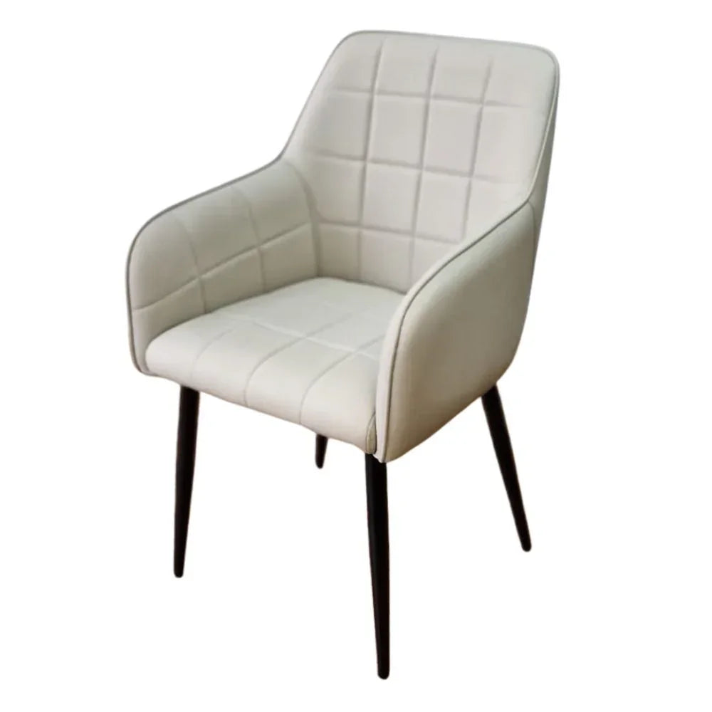 Taupe accent chair with quilted upholstery and black legs, angled front view