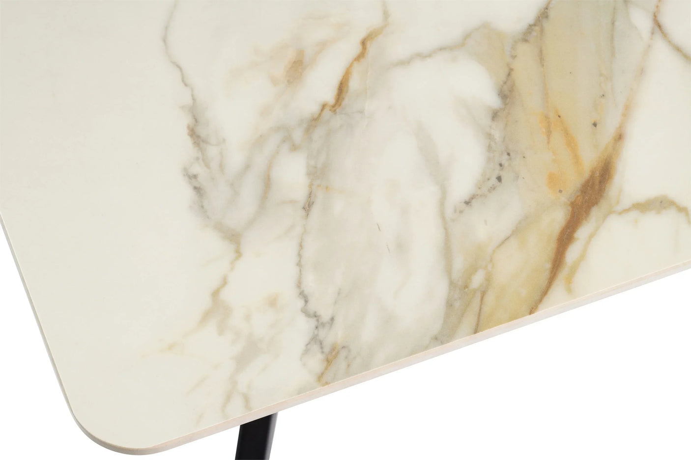 Close up of cream marble dining table top with natural veining and rounded edge