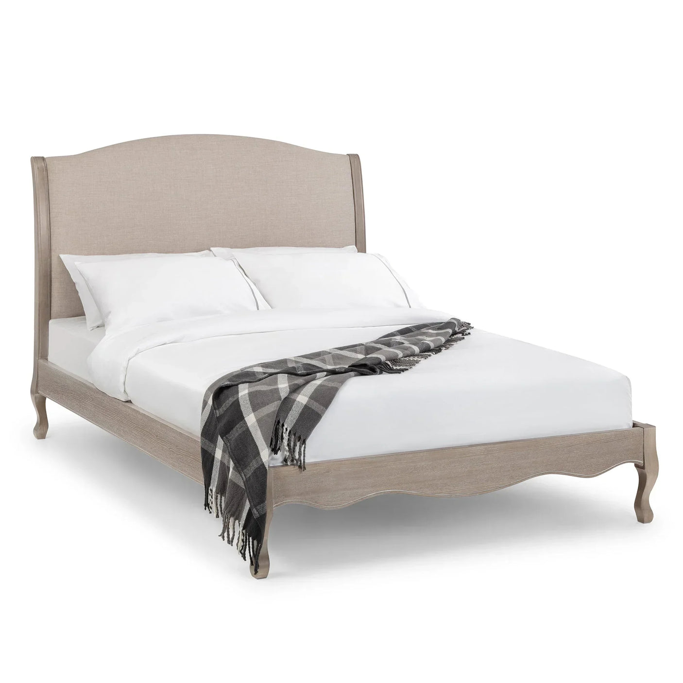 Beige double bed with upholstered curved headboard and checked throw on wooden frame