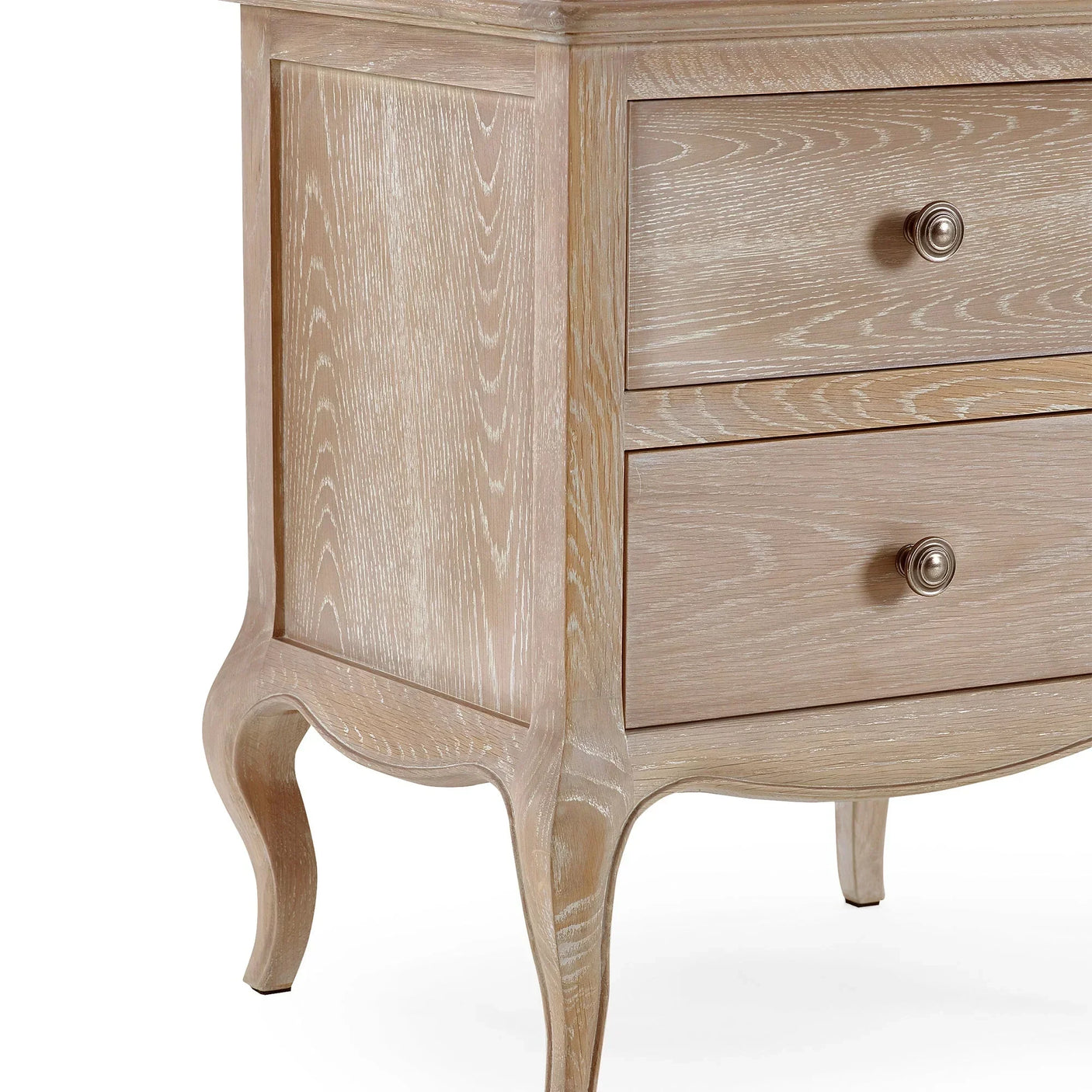 Oak bedside table with two drawers and curved legs, close-up of wood grain finish