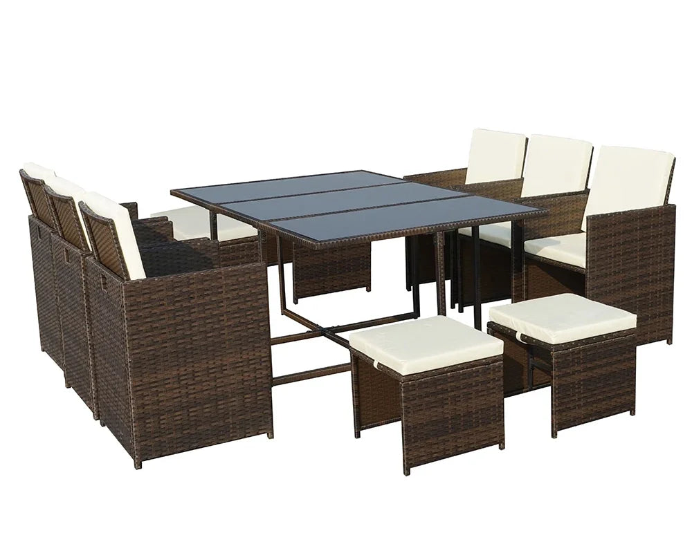 Brown rattan outdoor dining set with glass table, six cushioned chairs and four stools