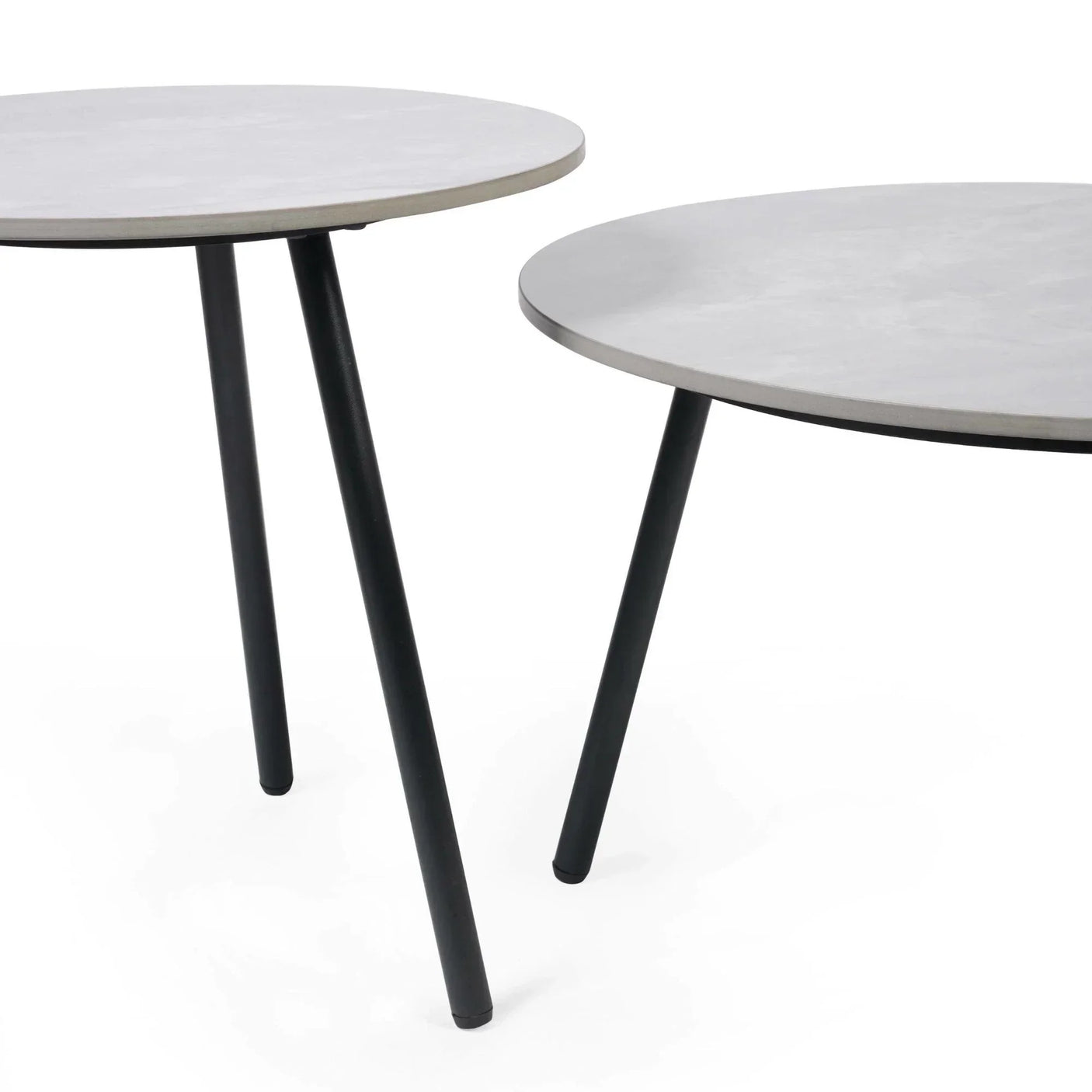 Round grey side tables with black metal legs on white background