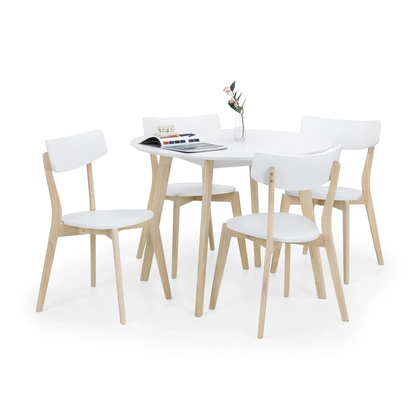 White dining table set with four wooden chairs, round top, and minimalist design