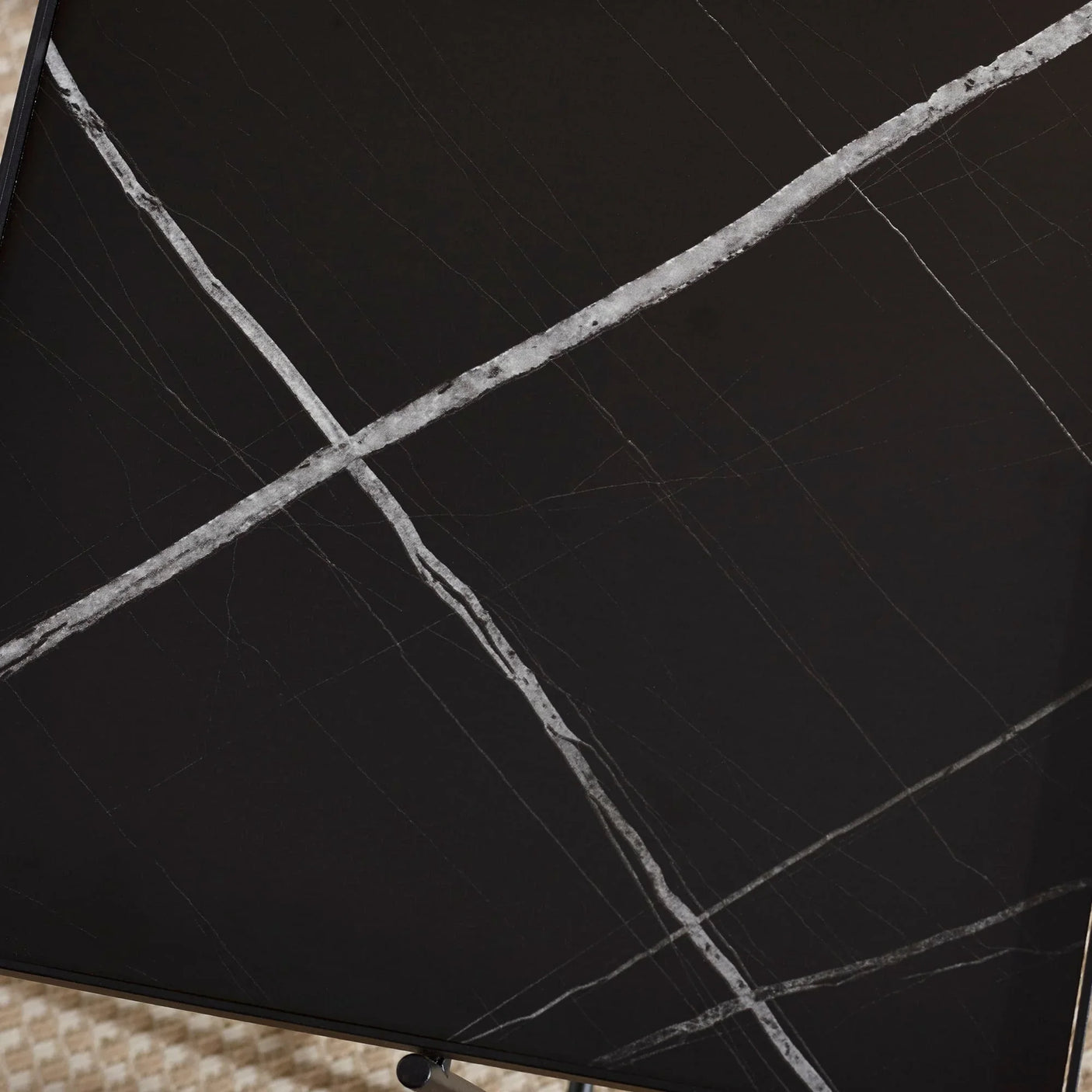 Black marble table top with white veining detail