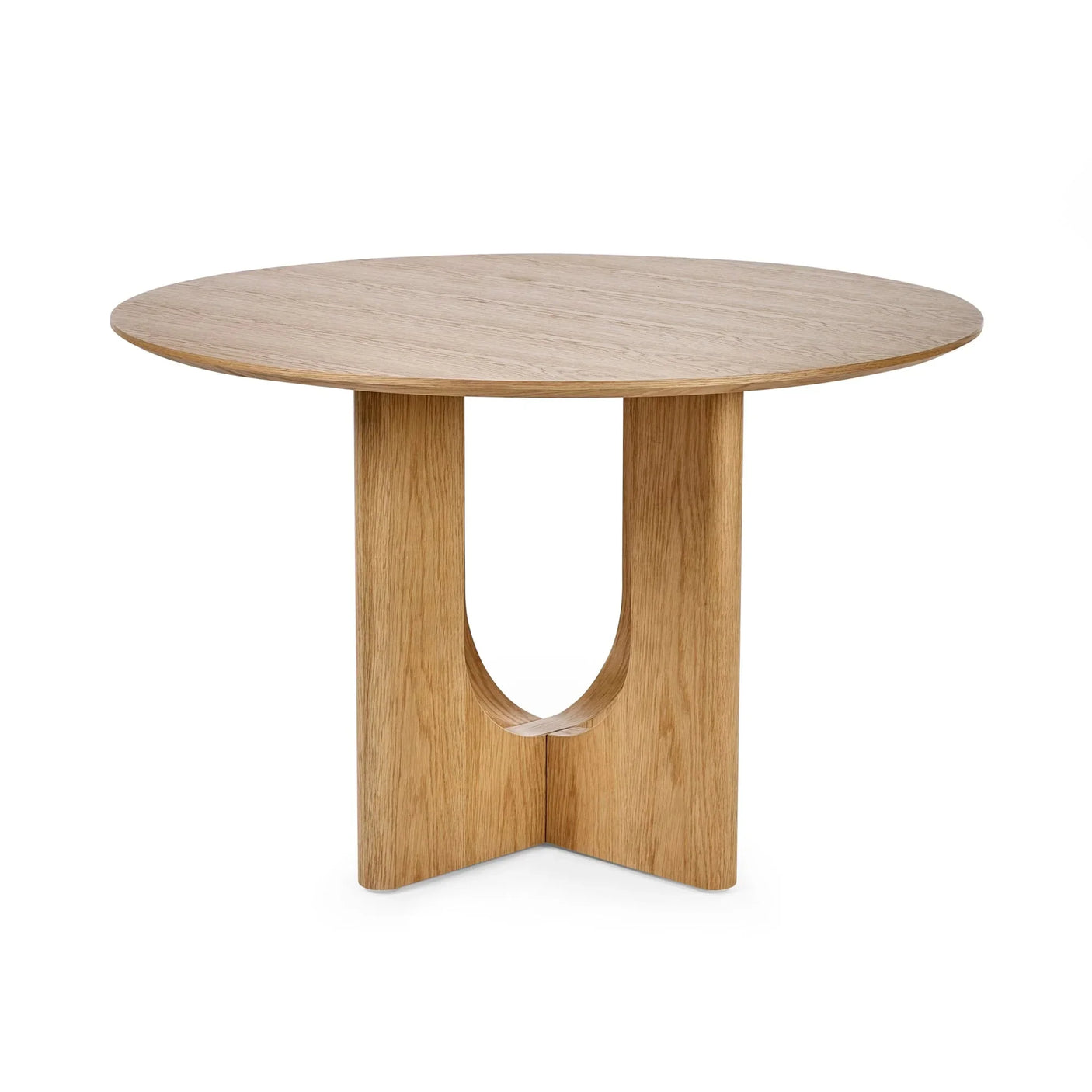 Round oak dining table with modern cross base and natural wood finish, front angle view
