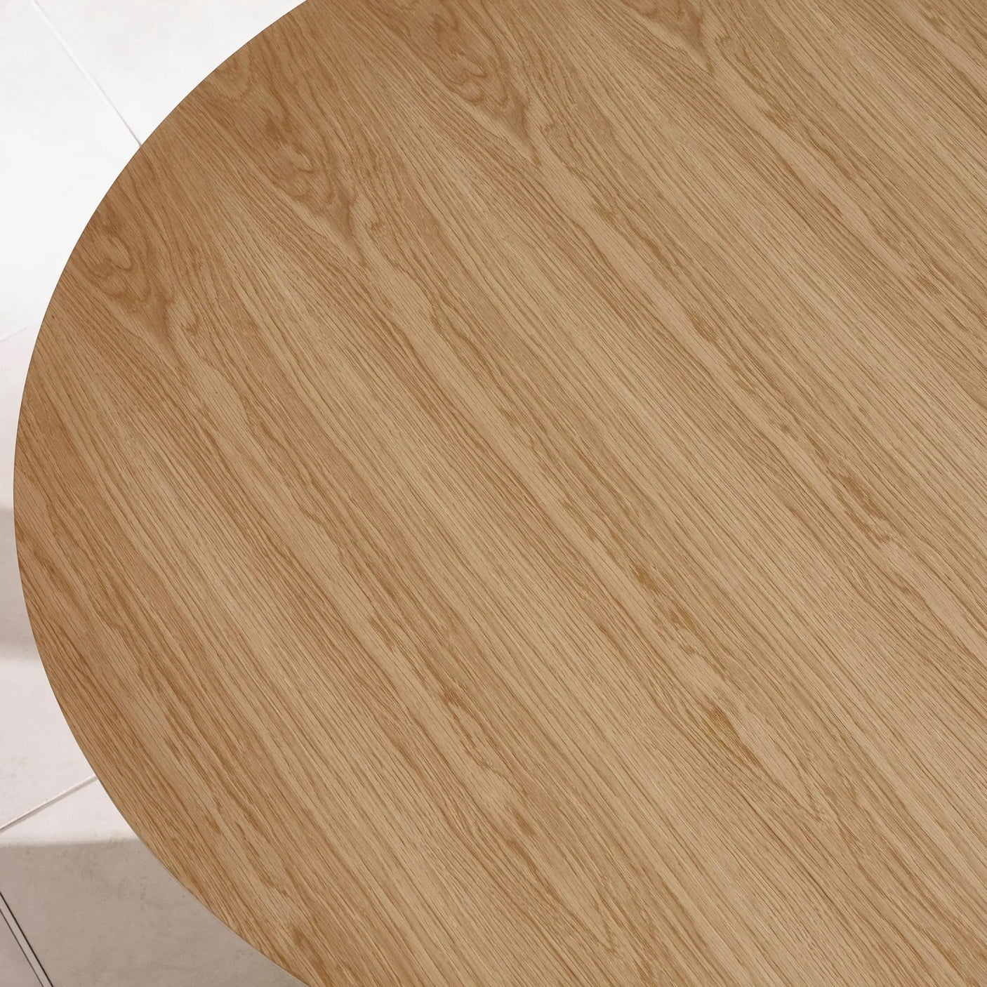 Round oak dining table top with natural wood grain pattern