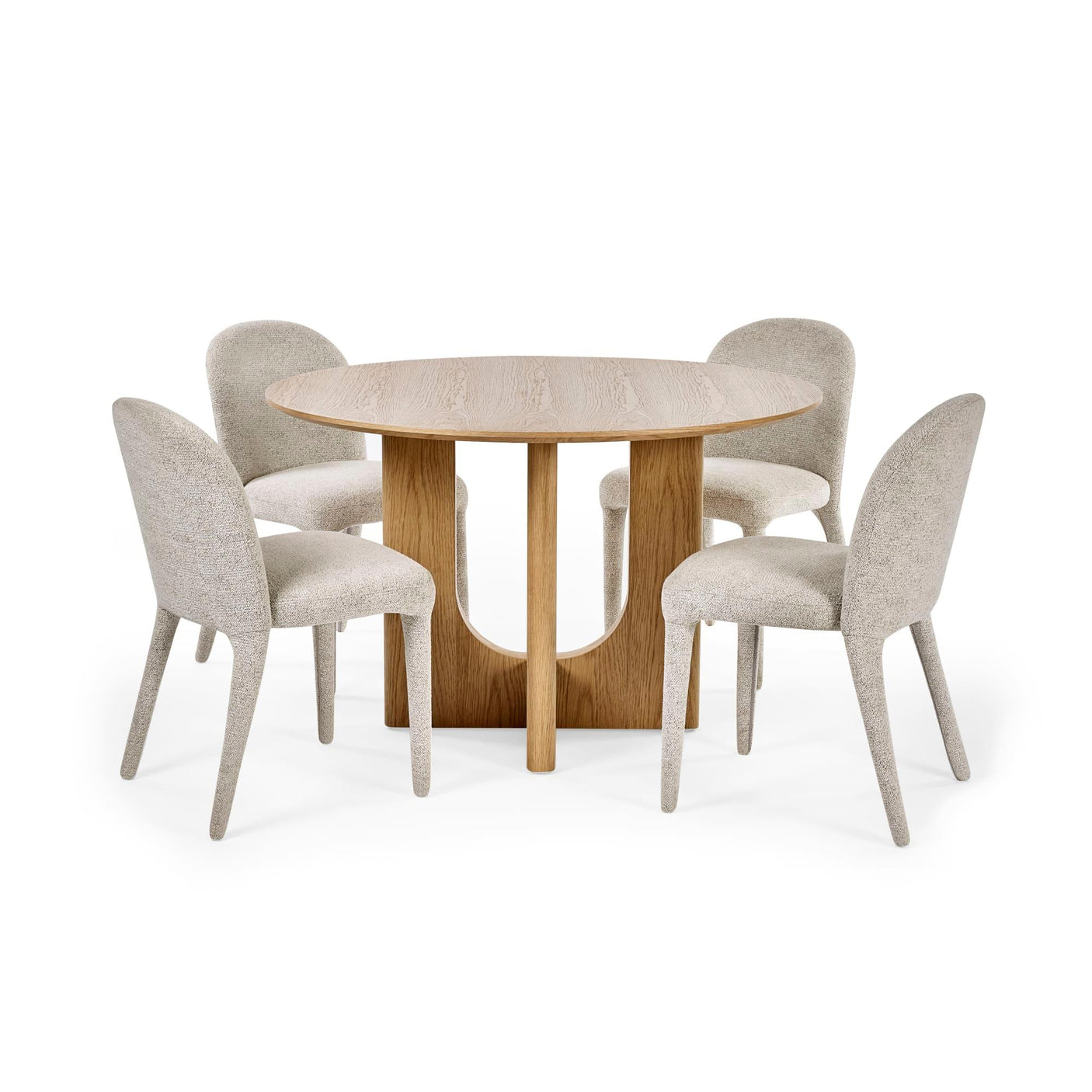 Round oak dining table with curved base and four upholstered beige dining chairs