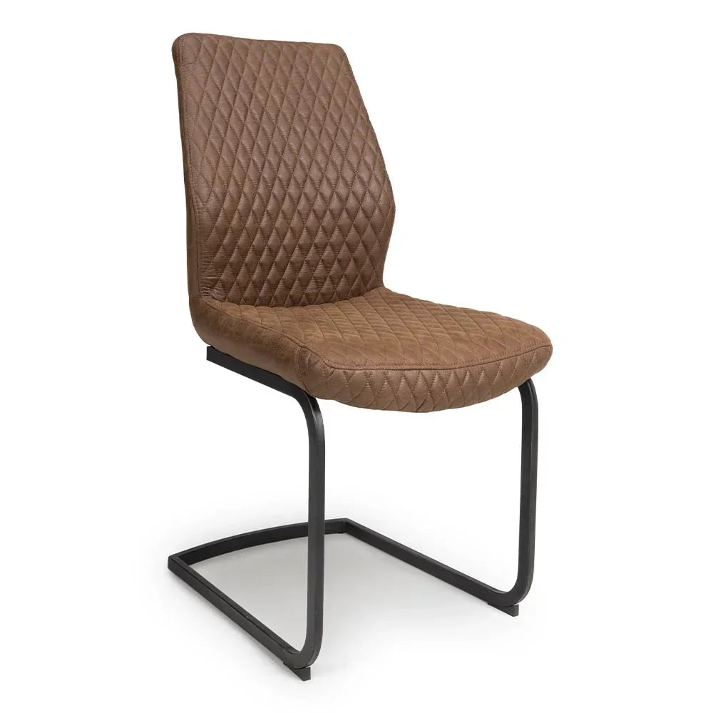 Brown quilted dining chair with cantilever metal frame and diamond stitching