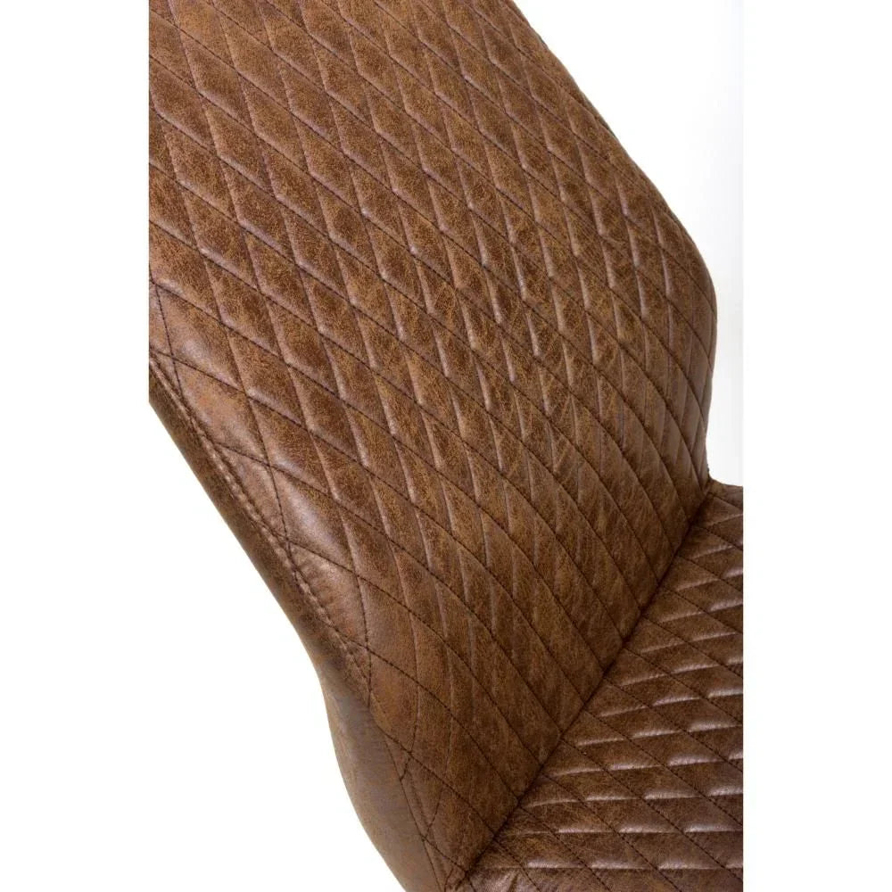 Brown leather dining chair with diamond stitched upholstery closeup