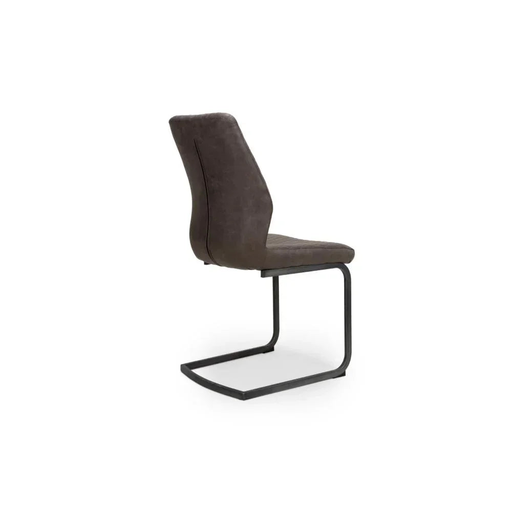 Grey dining chair with cantilever black metal frame and curved upholstered backrest side view