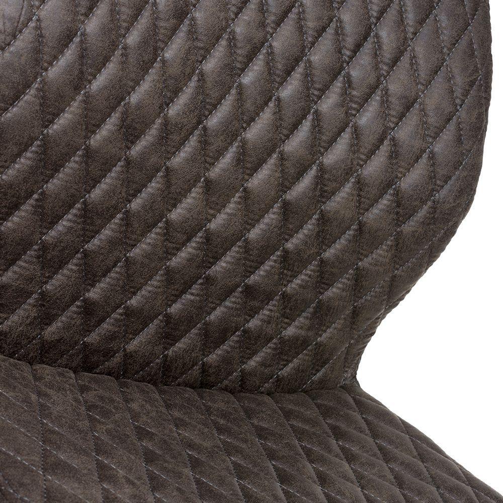 Closeup of quilted brown dining chair upholstery with diamond stitching