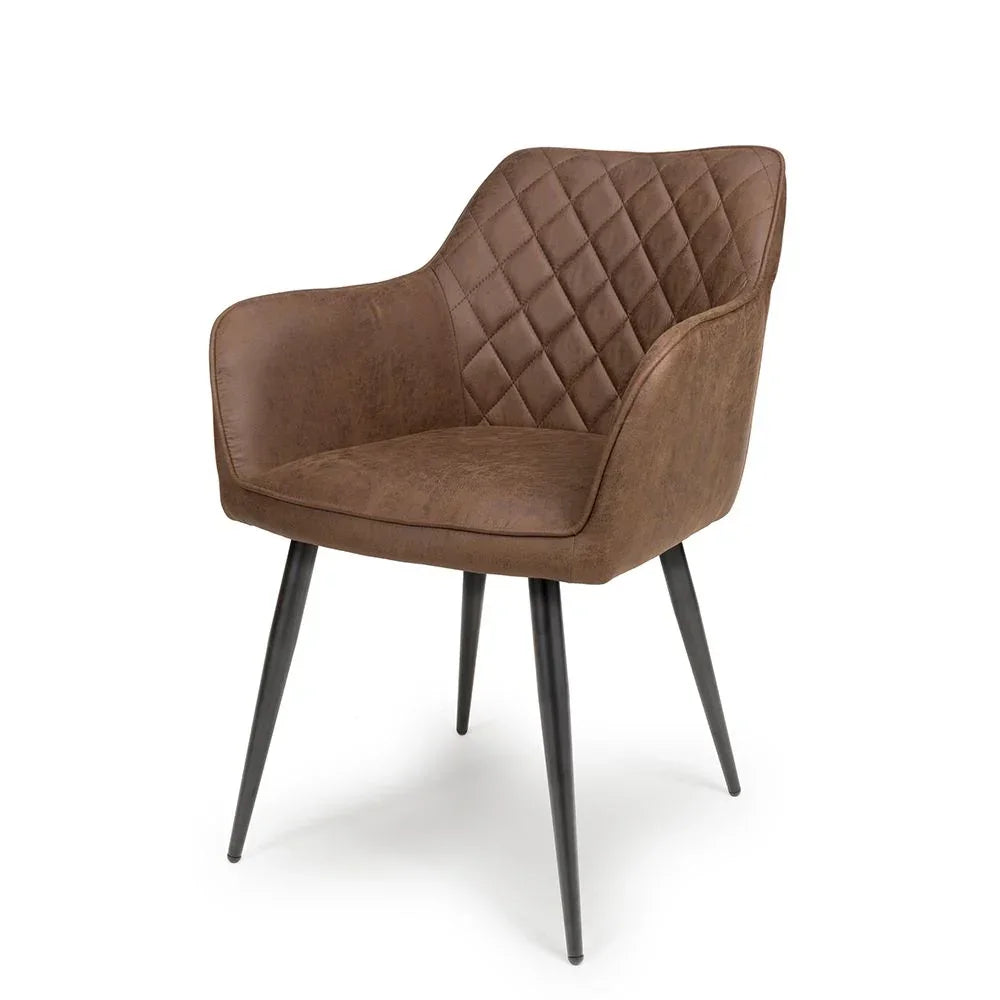 Brown faux leather dining chair with quilted backrest and black metal legs, angled view
