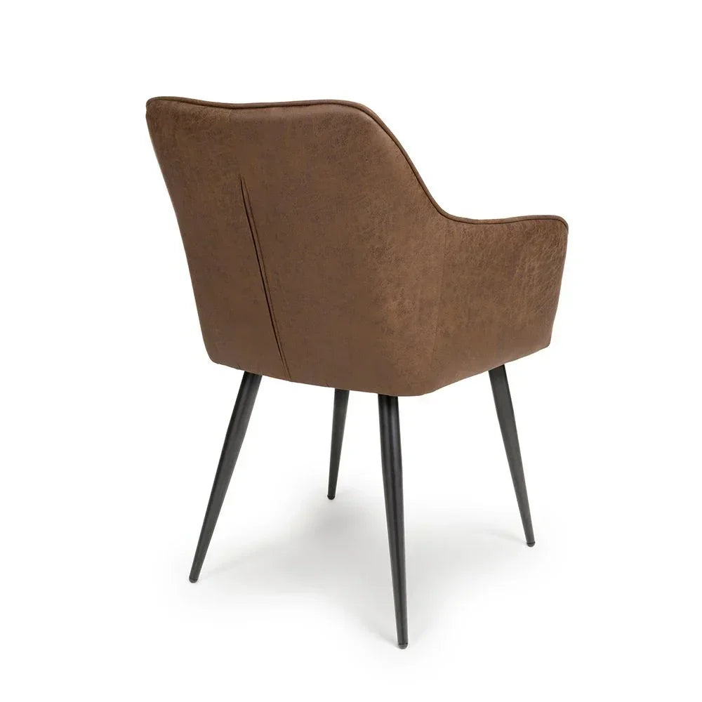 Brown upholstered dining chair with black metal legs, rear view