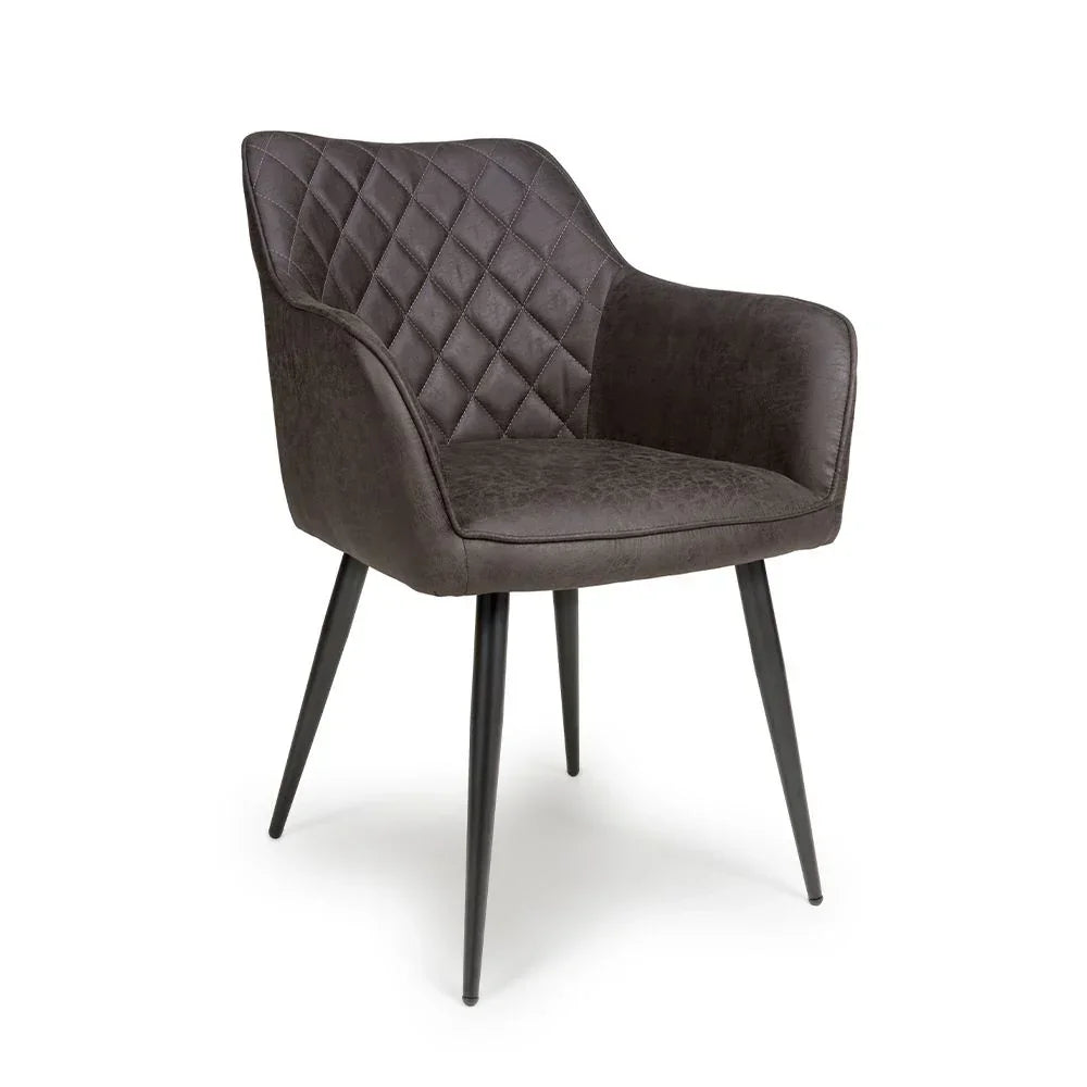Grey dining chair with diamond stitched backrest and slim black metal legs