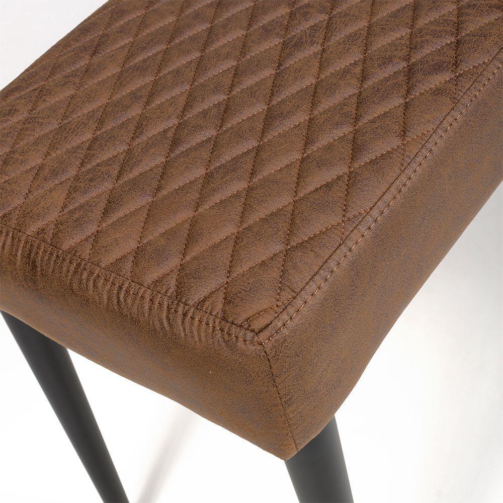 Brown faux leather dining chair with diamond stitch detail and black metal legs, close view