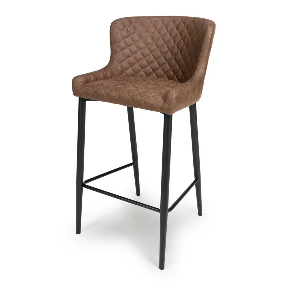 Brown quilted bar stool with cushioned seat and black metal legs