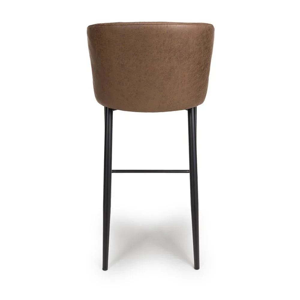 Brown faux leather bar stool with black metal legs, rear view