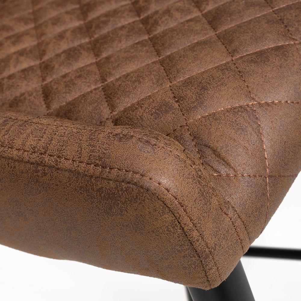 Close view of brown faux leather dining chair seat with diamond stitching detail