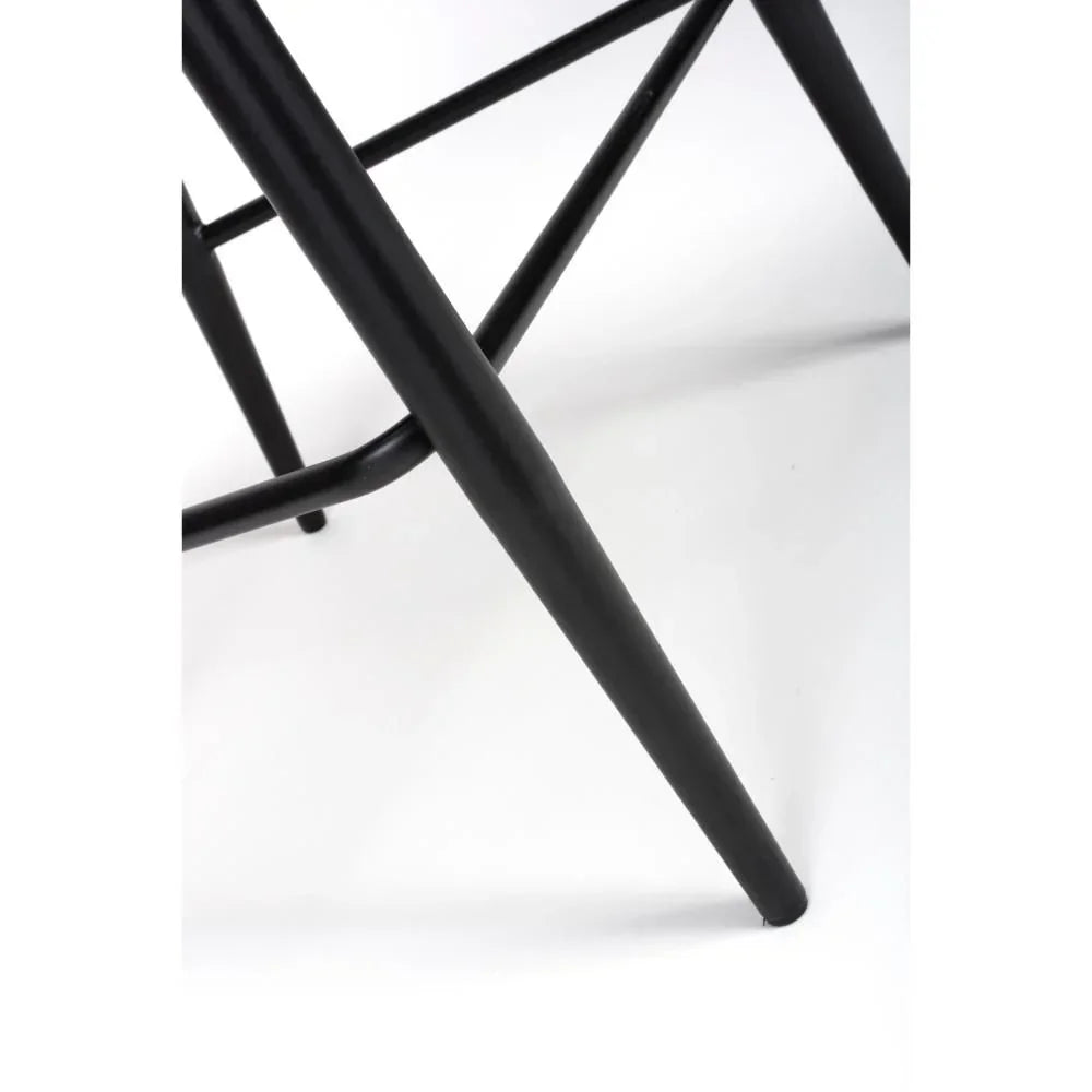 Black metal chair leg detail with crossbar on white background