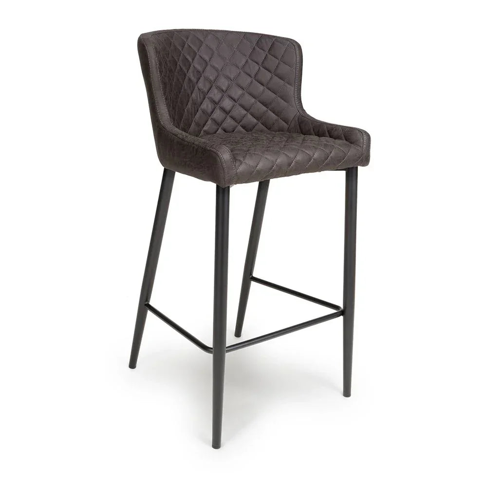 Quilted bar stool with dark brown upholstered seat and black metal legs