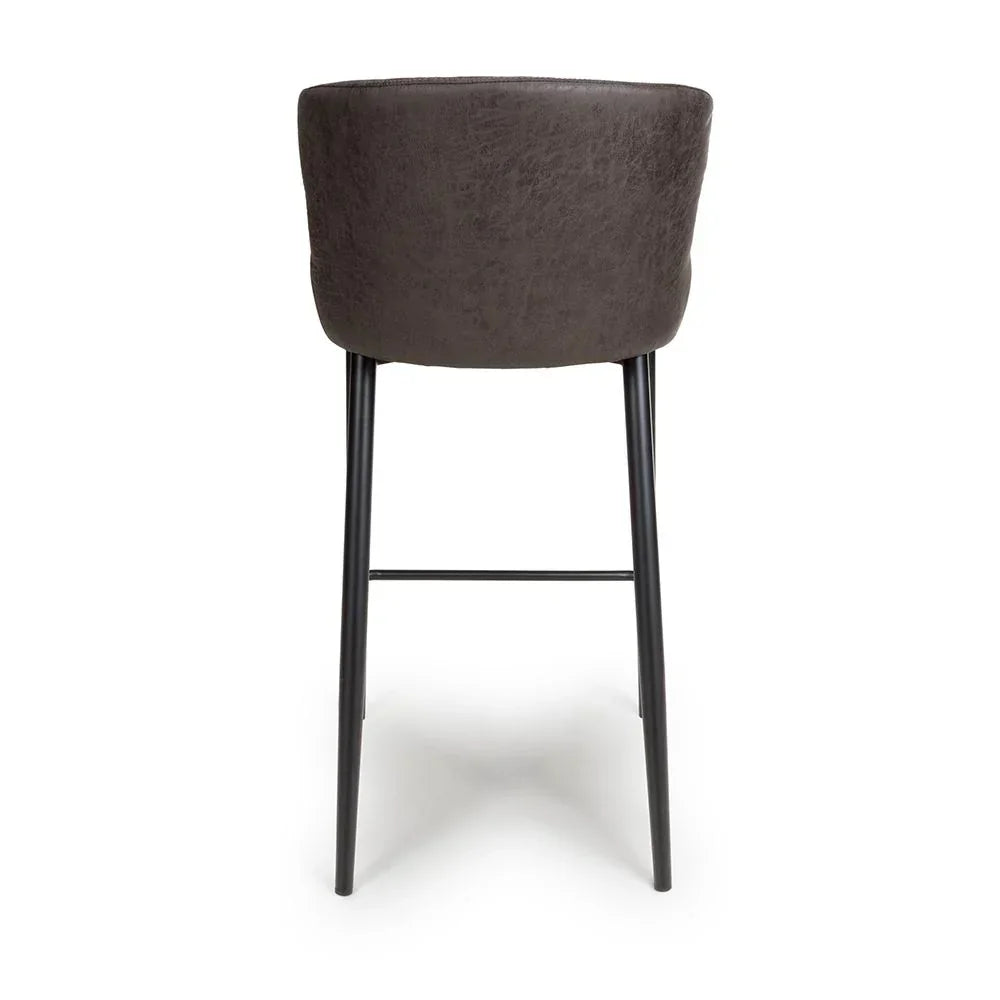 Back view of grey bar stool with curved seat and black metal legs