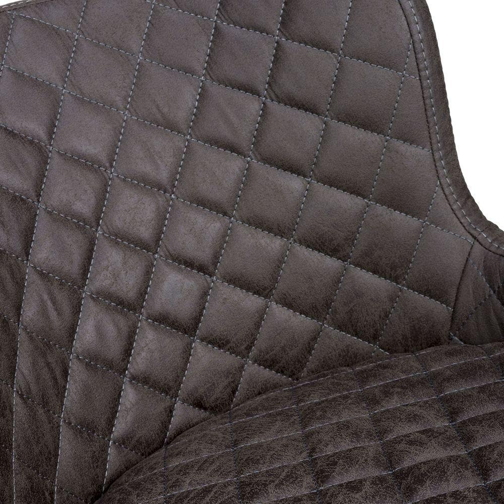 Close up of brown faux leather dining chair with quilted stitching detail