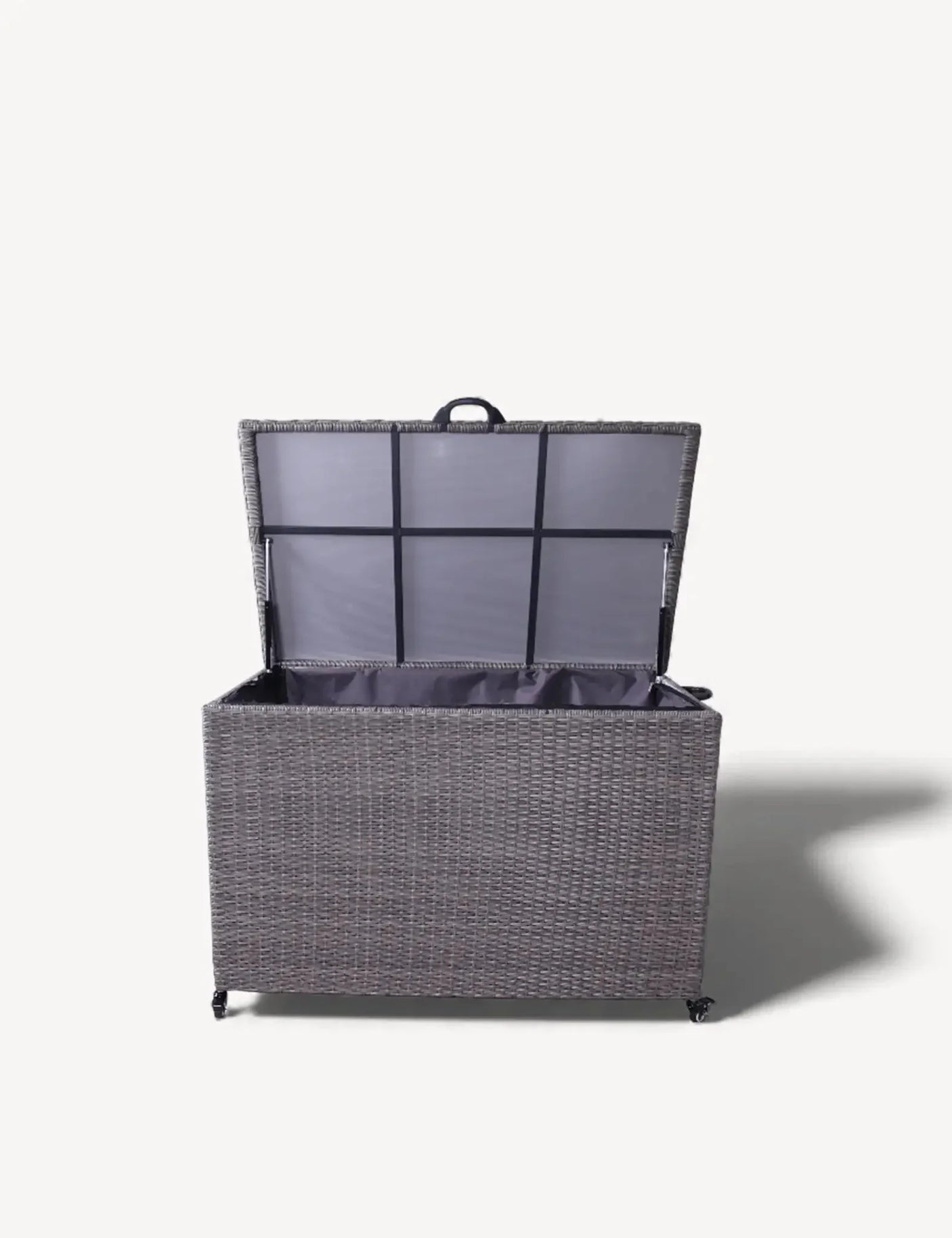Grey rattan storage box with open lid and fabric lining, front view on white background