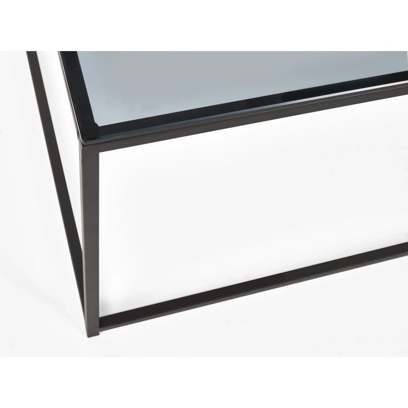 Glass top coffee table with black metal frame corner detail