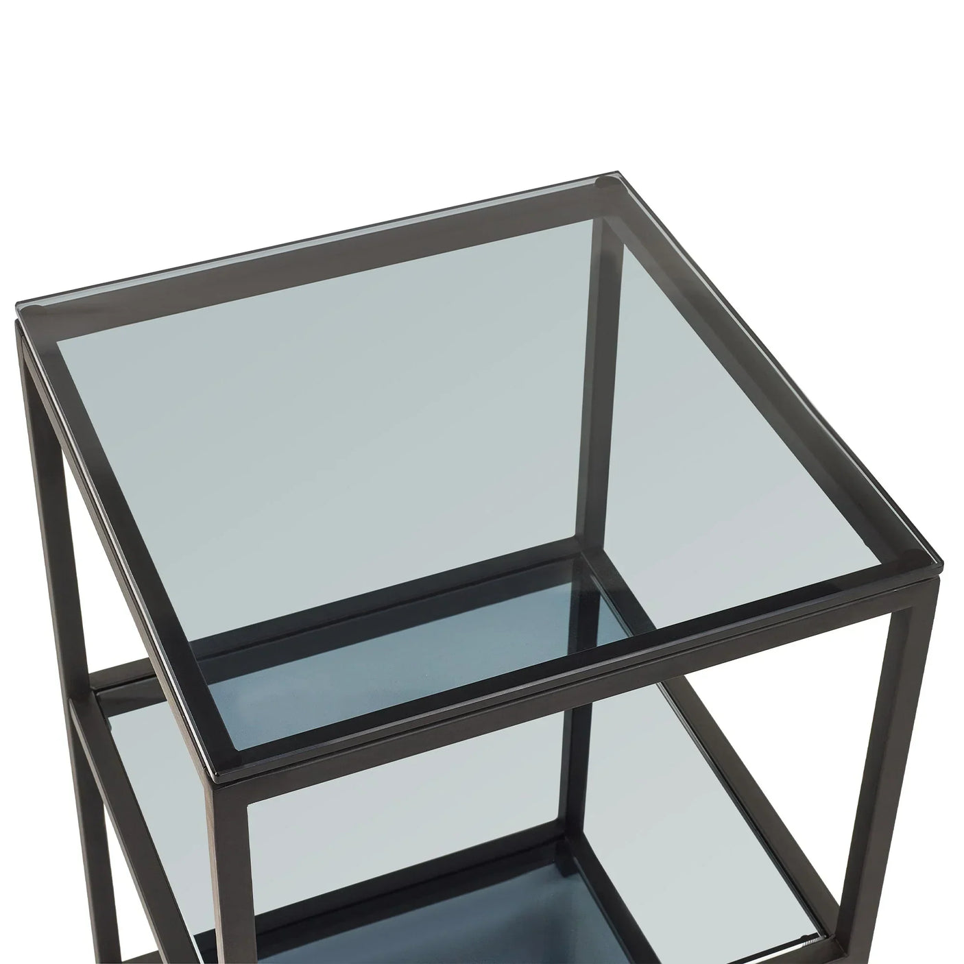 Tall narrow side table with black metal frame and clear glass shelves, angled detail view