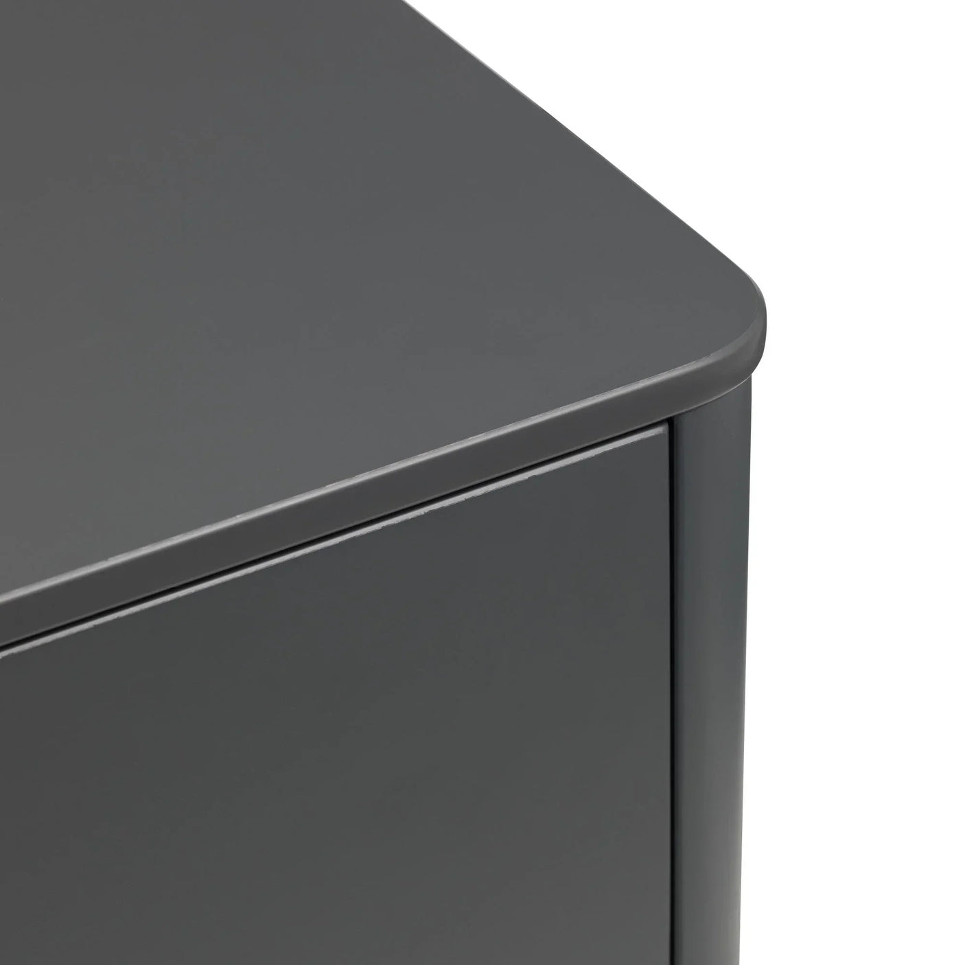 Closeup of grey cabinet corner with smooth matte finish and curved edge detail