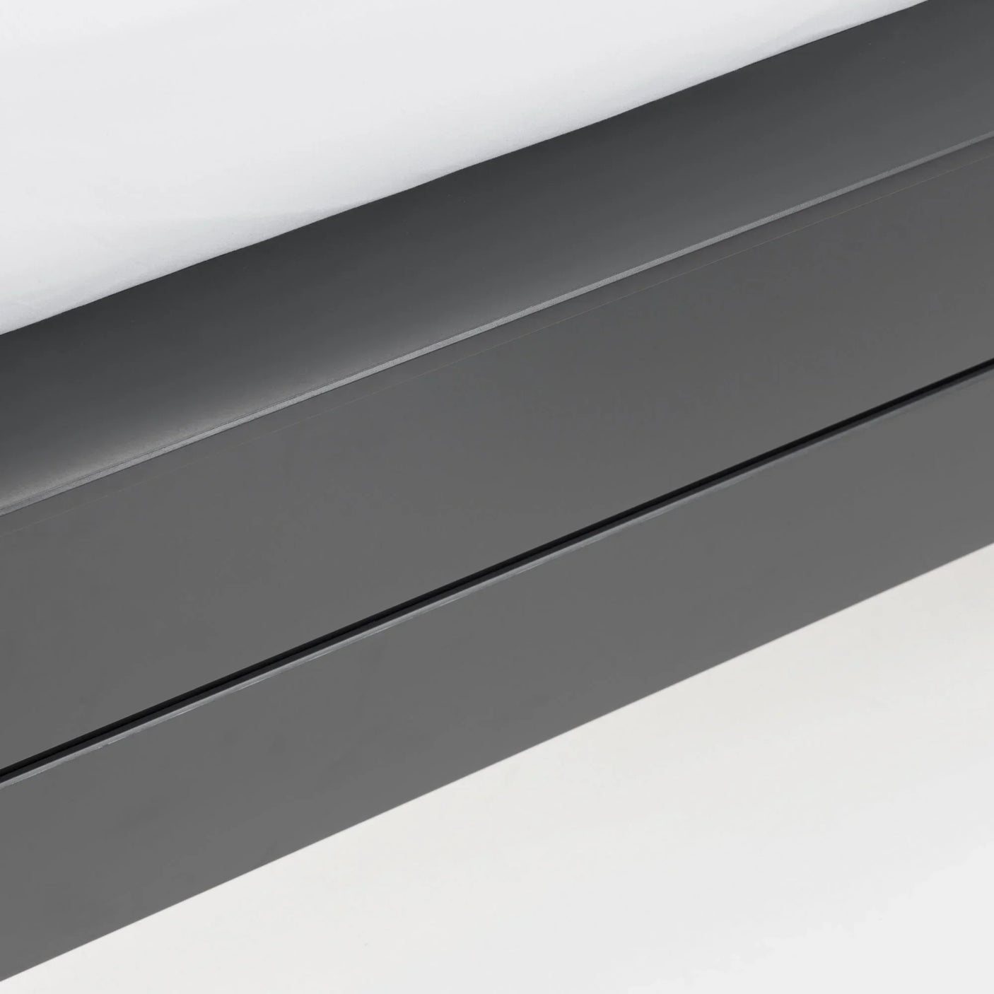 Close-up of dark grey Chloe king bed frame footboard with smooth finish