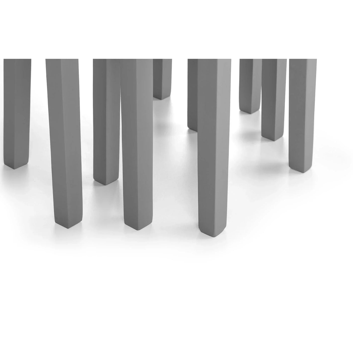 Grey nest of tables legs grouped together on white background