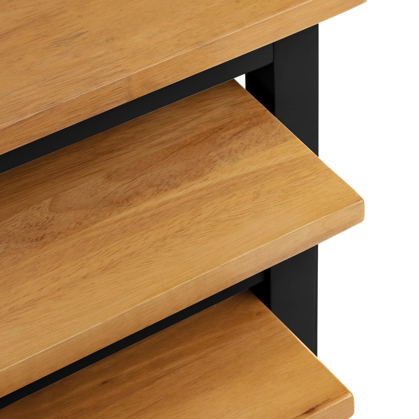 Close view of wooden shelving unit with black metal frame and smooth oak finish shelves