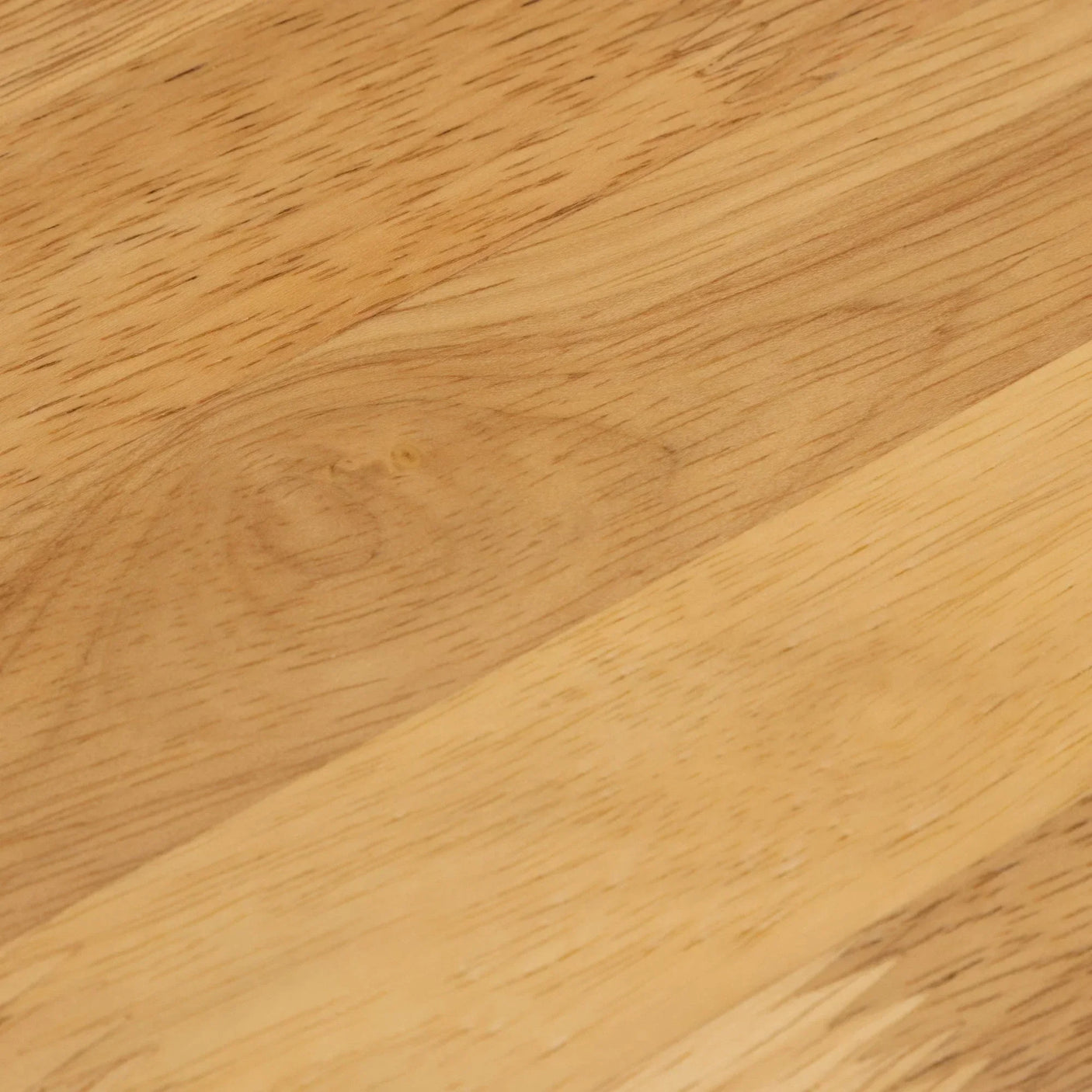 Closeup of light oak wood grain tabletop surface with natural finish