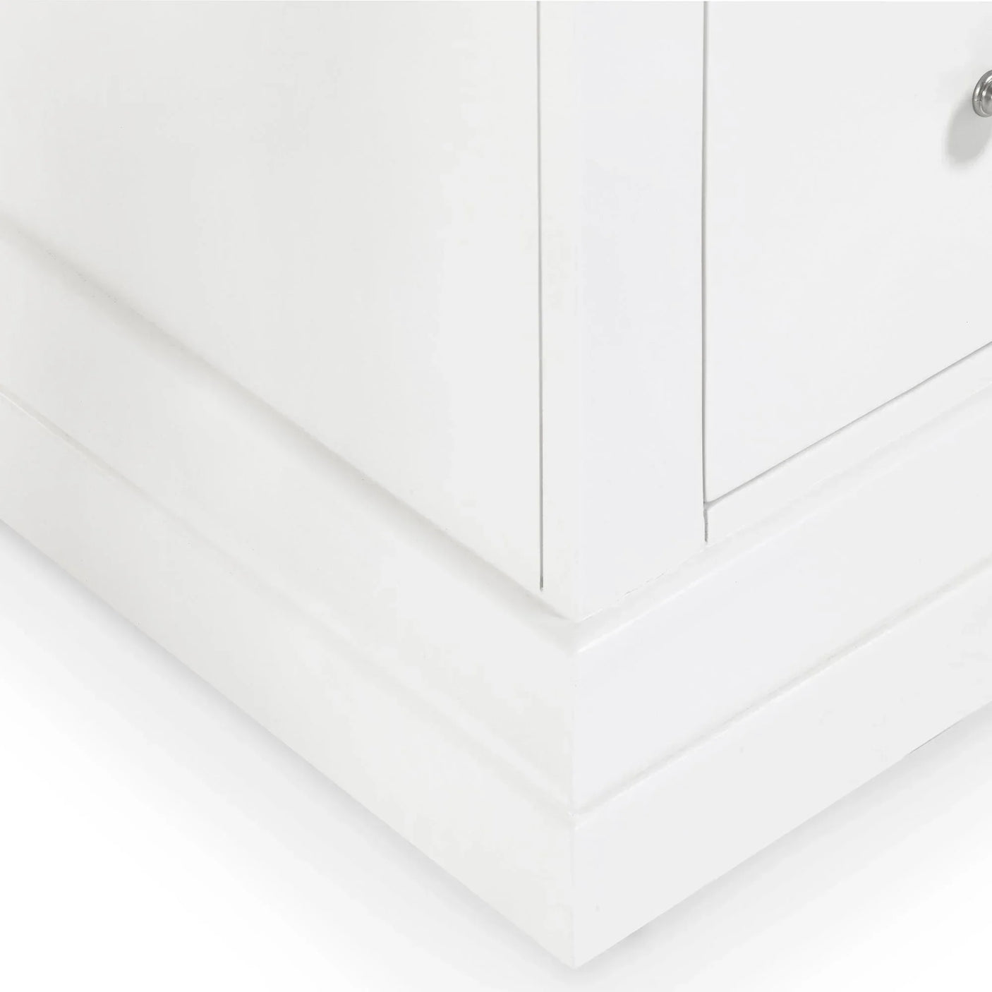 White dressing table base with smooth painted finish and panel detail in close-up view