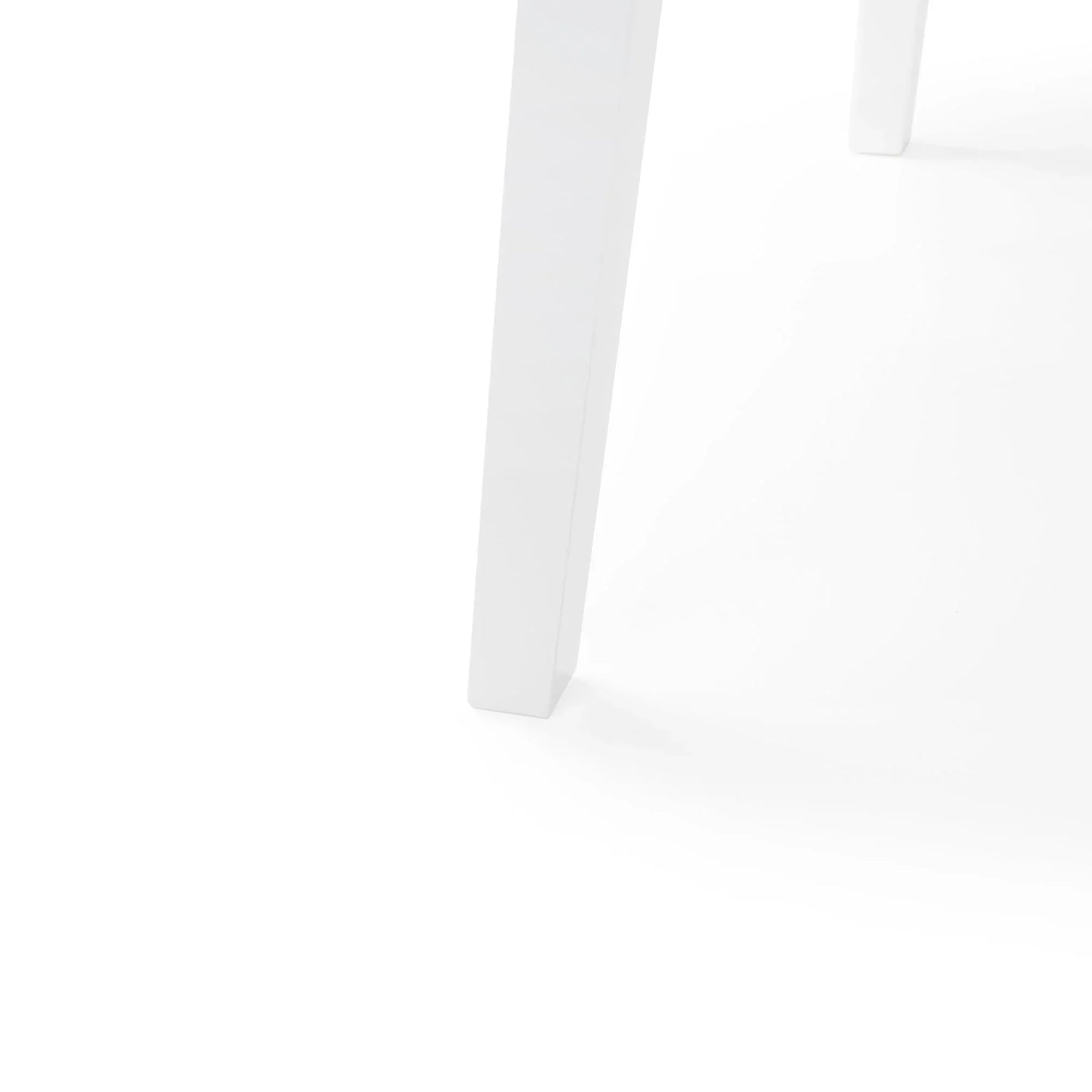 White dining table legs with minimalist design and smooth painted finish