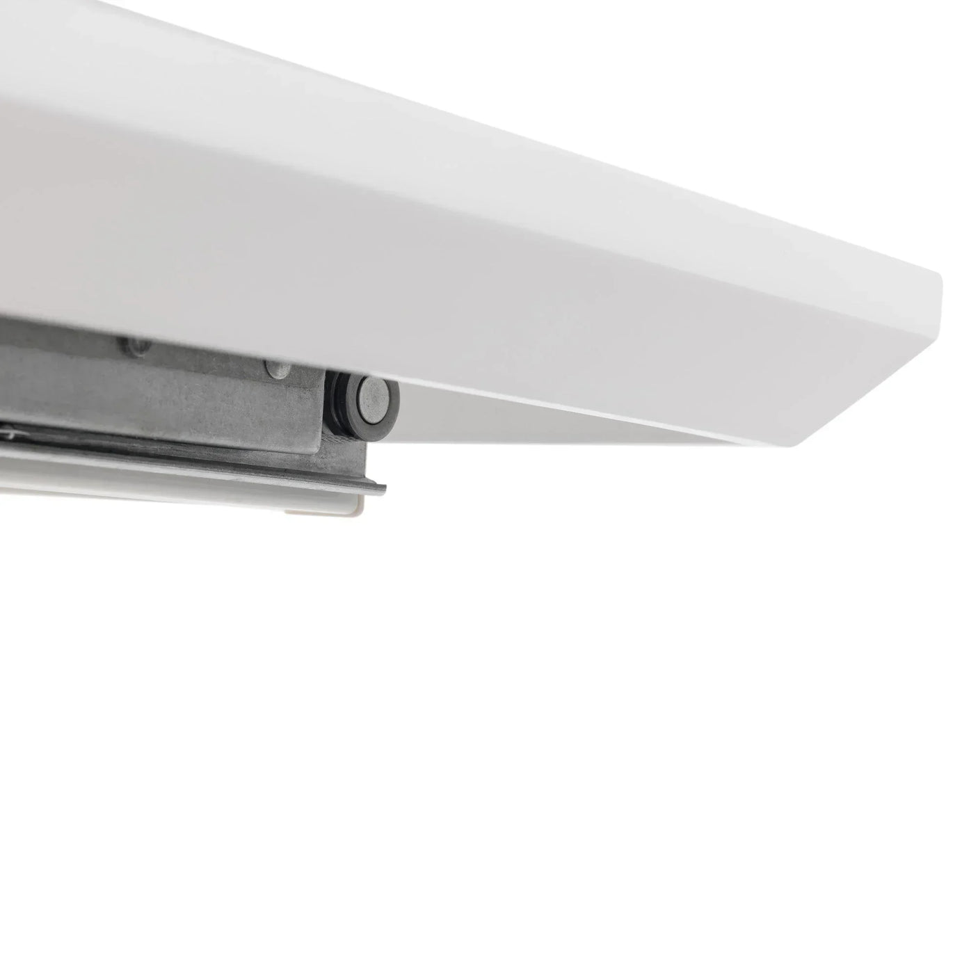 Closeup of white dining table extension rail mechanism in metal and wood