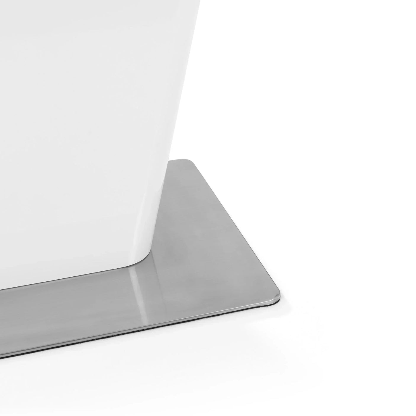 Glossy white table leg on rectangular chrome metal base