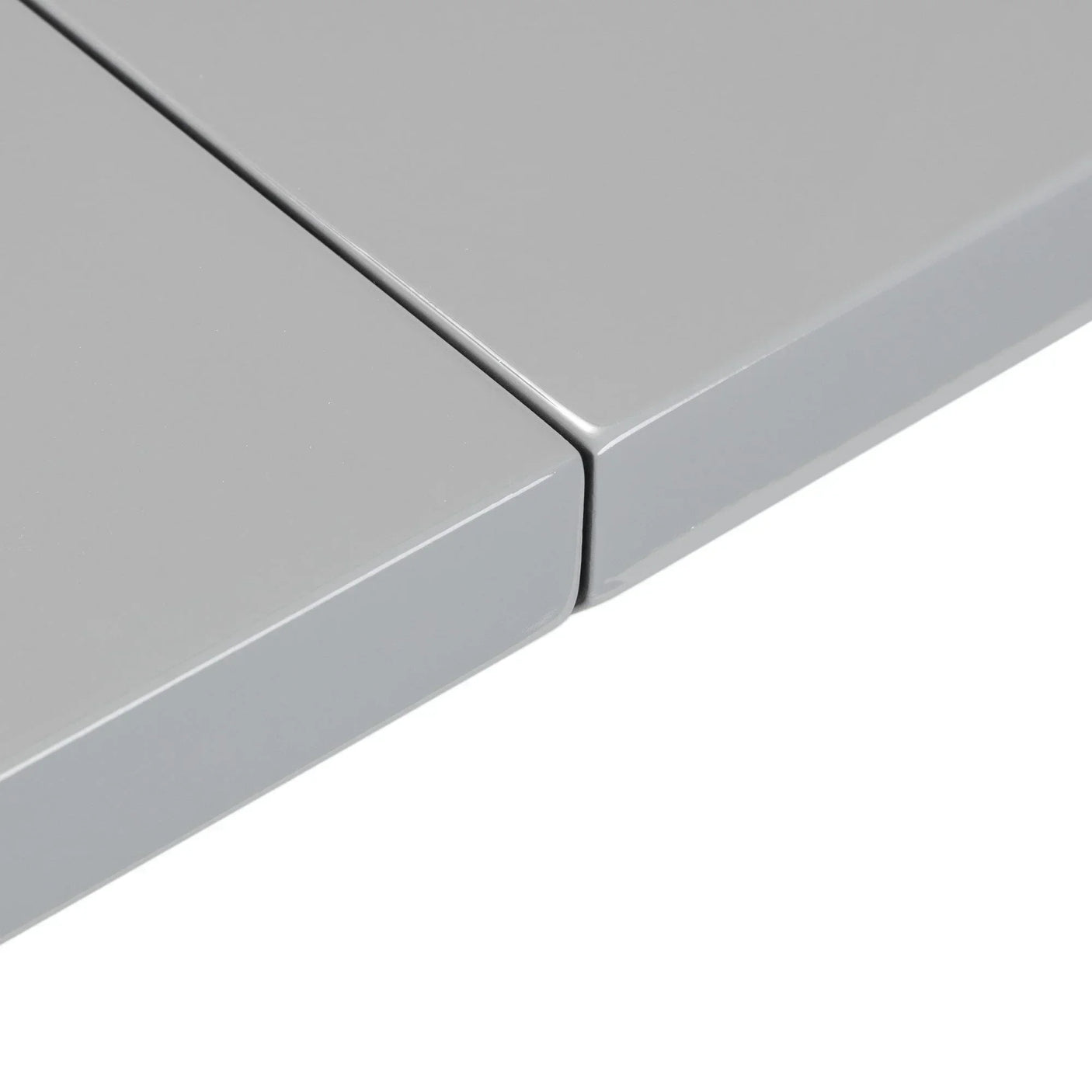 Close-up of grey gloss dining table extension leaves with smooth finish