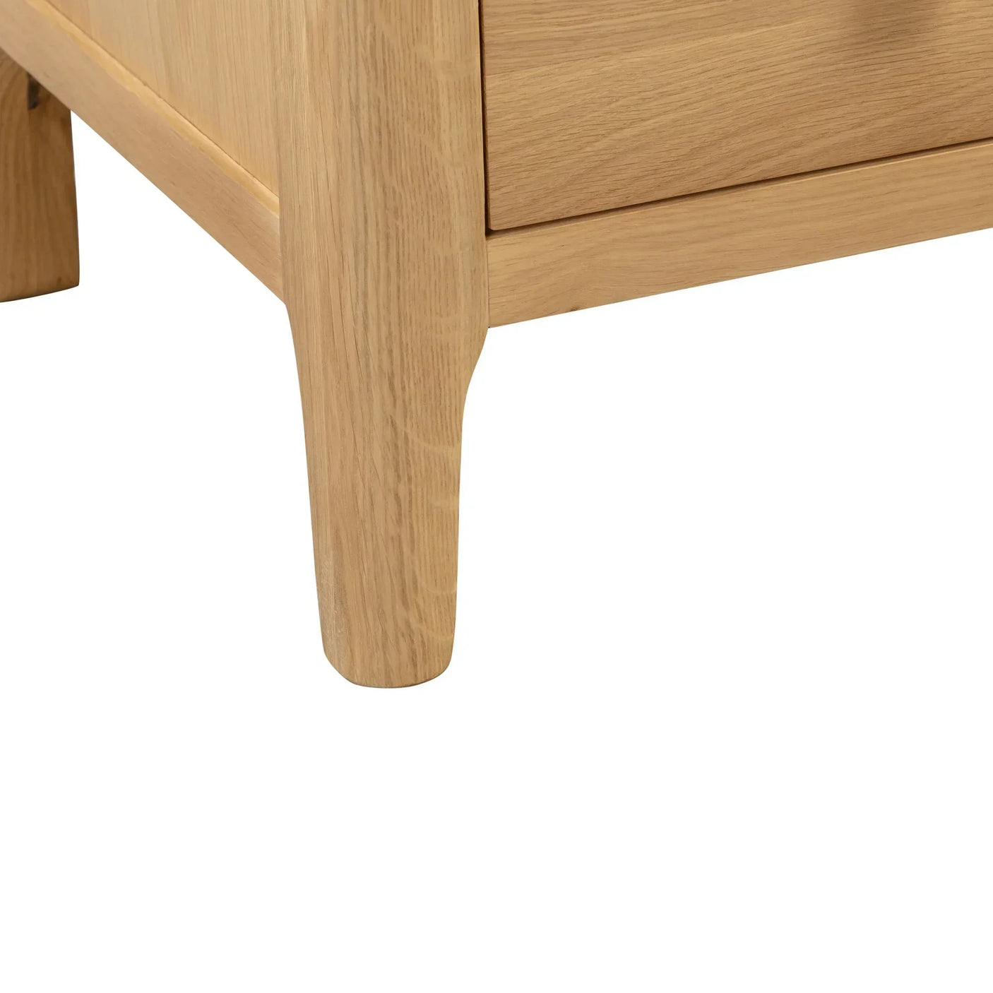 Oak chest of drawers leg showing natural wood grain and corner detail